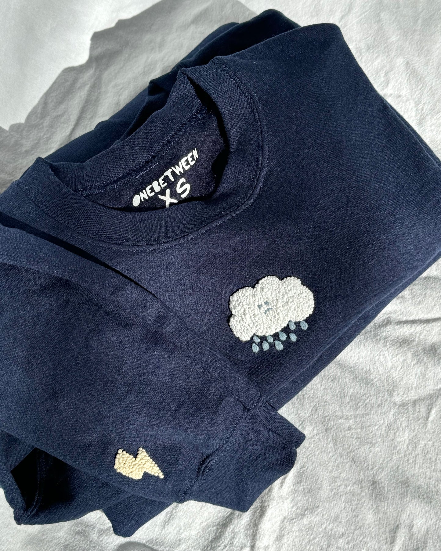 sad cloud crewneck