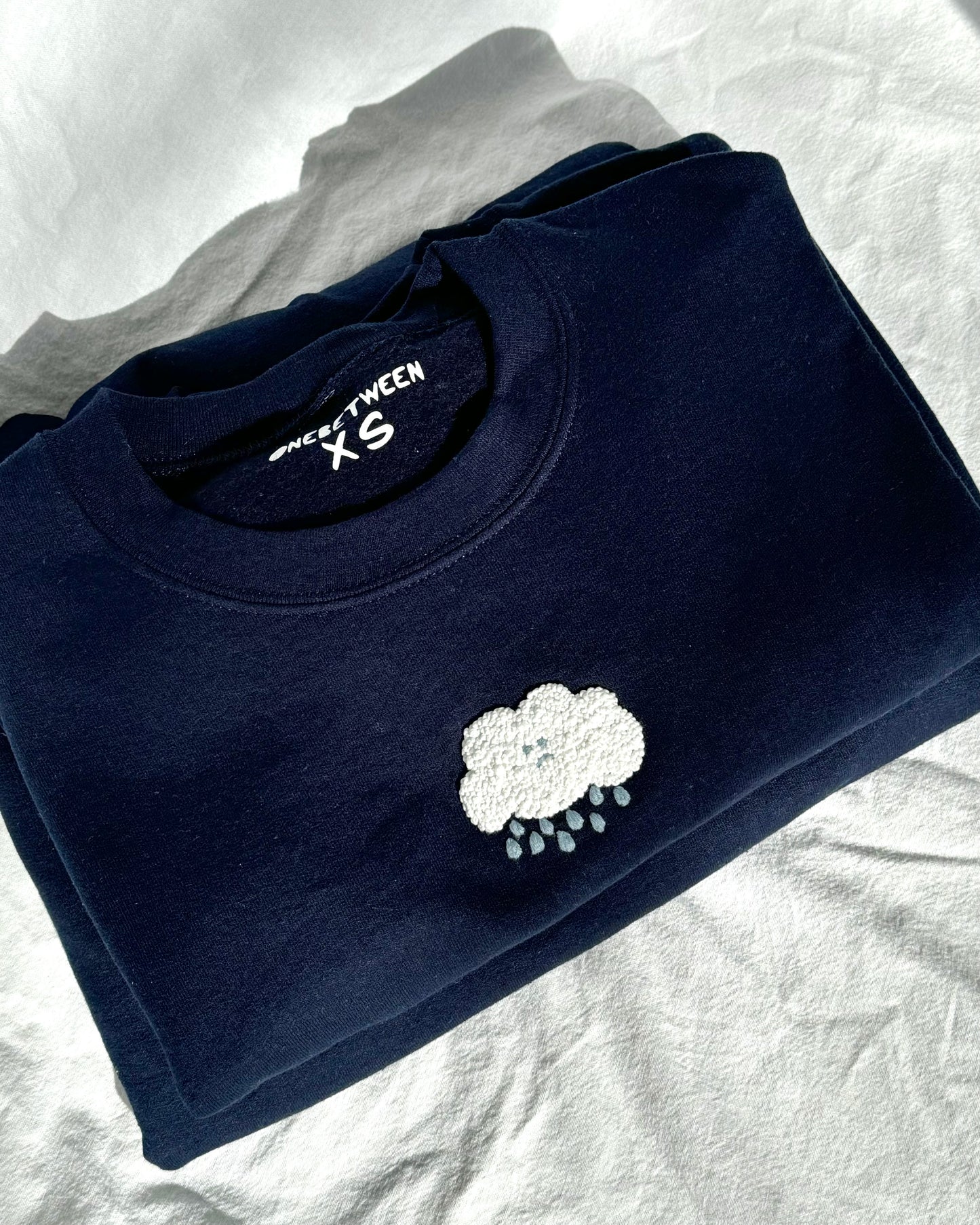 sad cloud crewneck