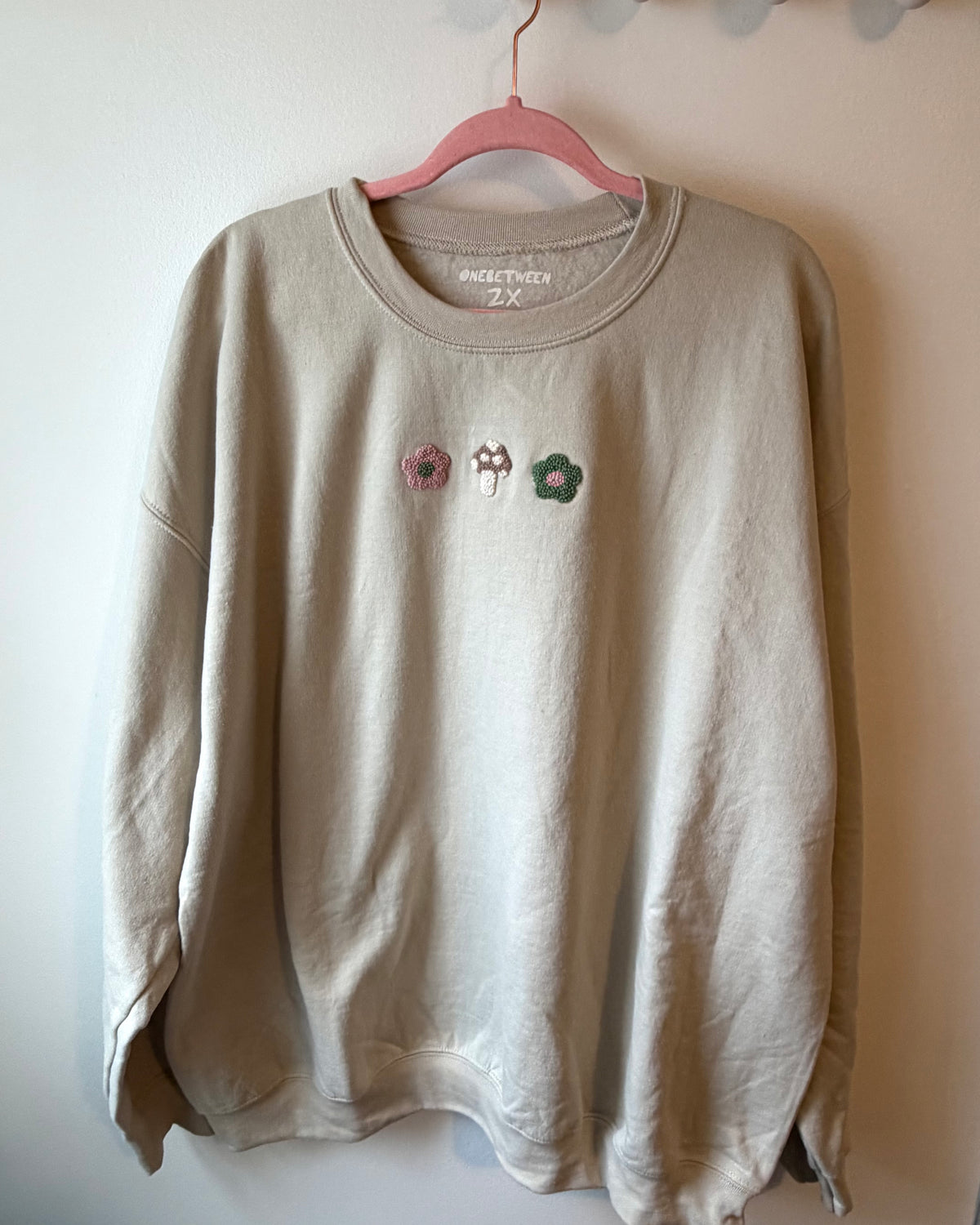 Green and pink mushroom crewneck